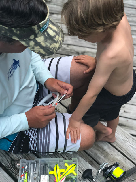 Father and son with fishing lures