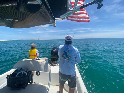 Fishing off the back of a trolling boat