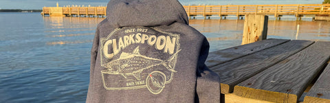 Clarkspoon fishing hoodie hanging on a dock