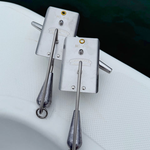 Clarkspoon fishing planers on boat gunwale