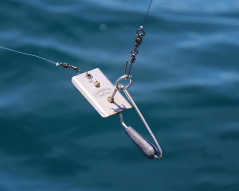 Fishing planer with blue water background