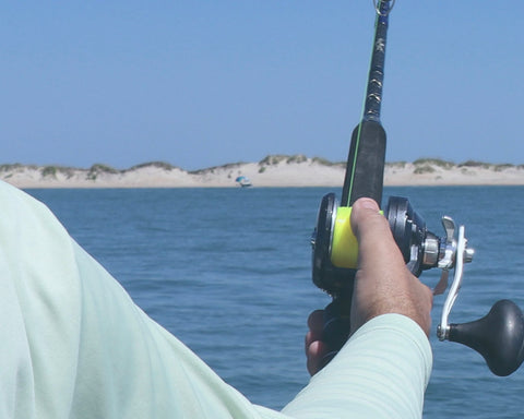 Fishing reel with line being let out