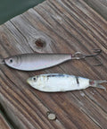Clarkspoon shad jig next to real bait fish